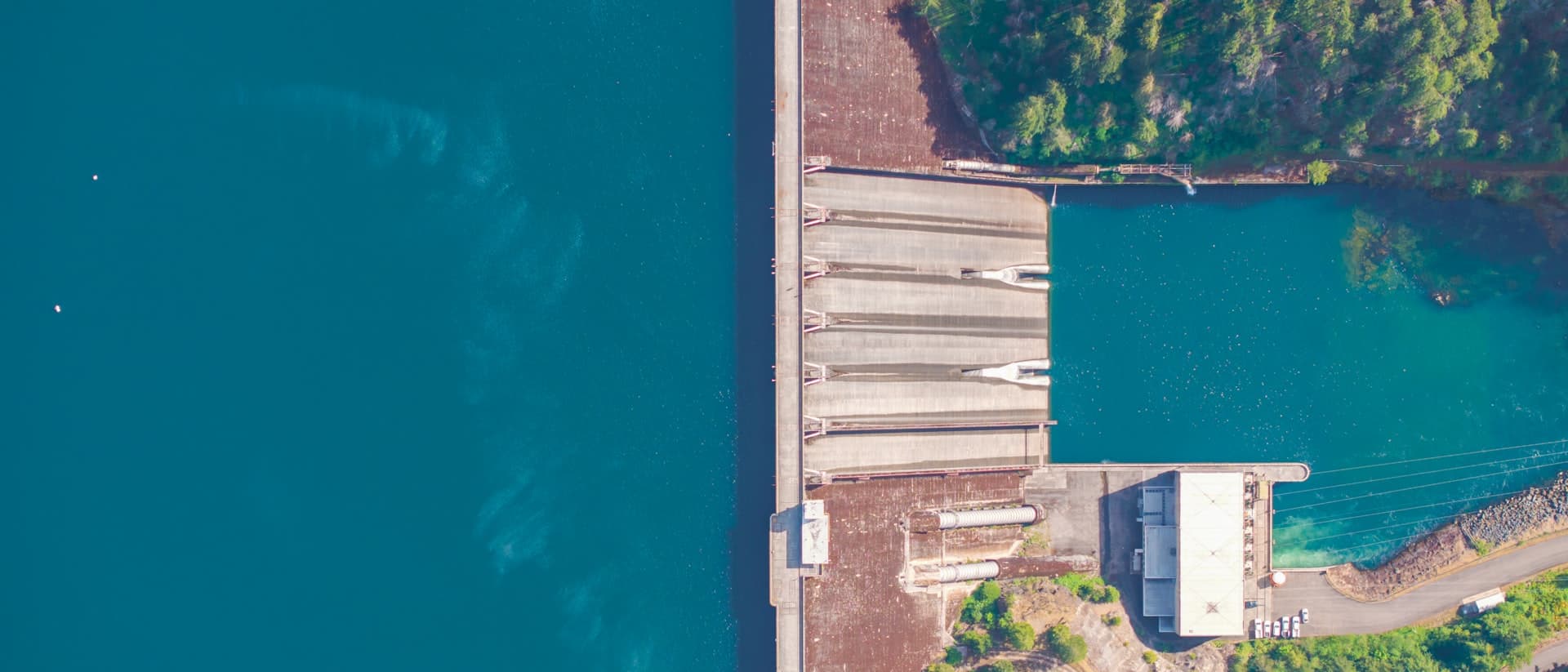 Aerial view of Detroit Dam and reservoir in Oregon, representing dams sector infrastructure